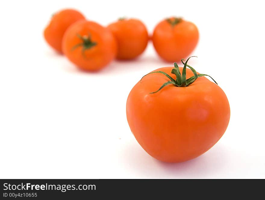 Red tomatos isolated on white. Red tomatos isolated on white