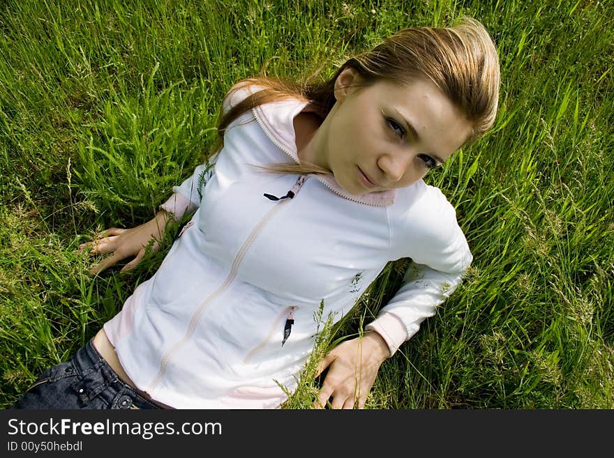 Young adult girl on green grass. Young adult girl on green grass