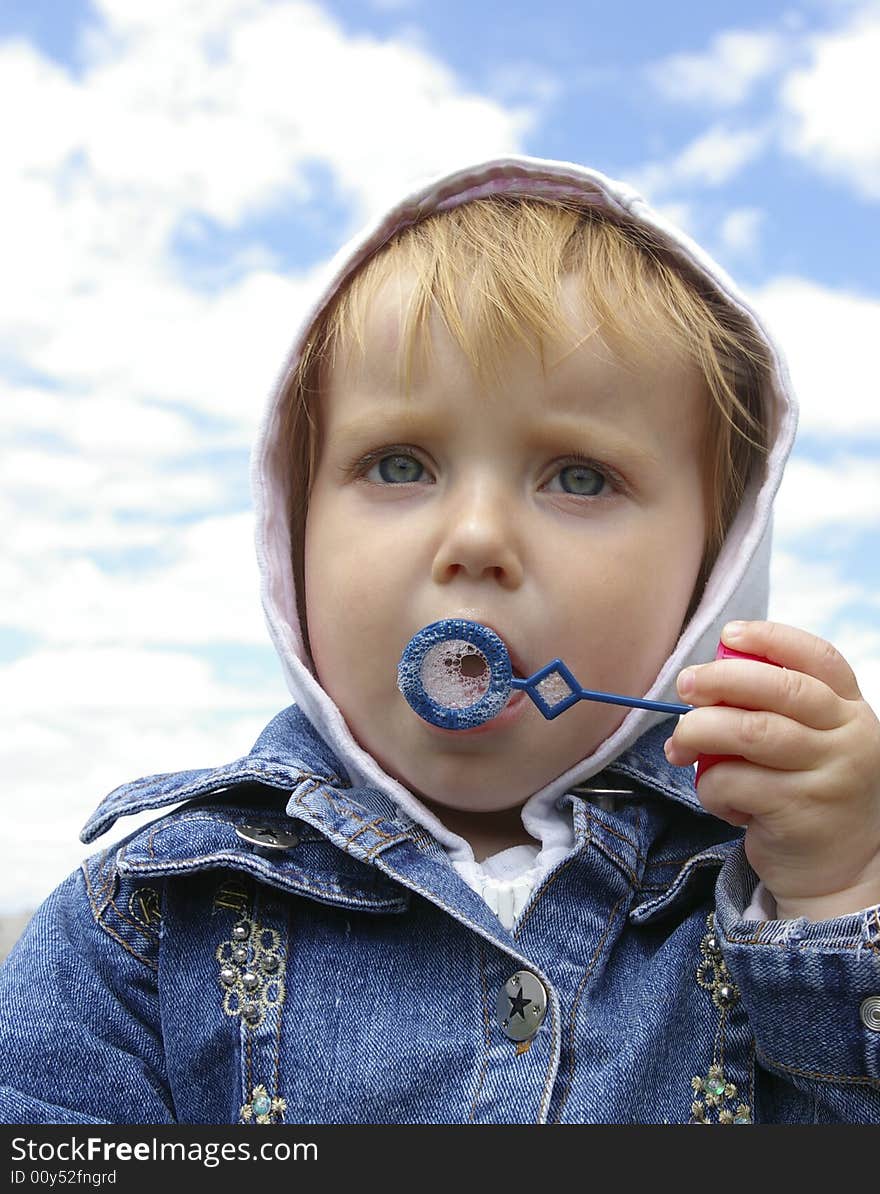 Little Girl Making Soap Bubbles