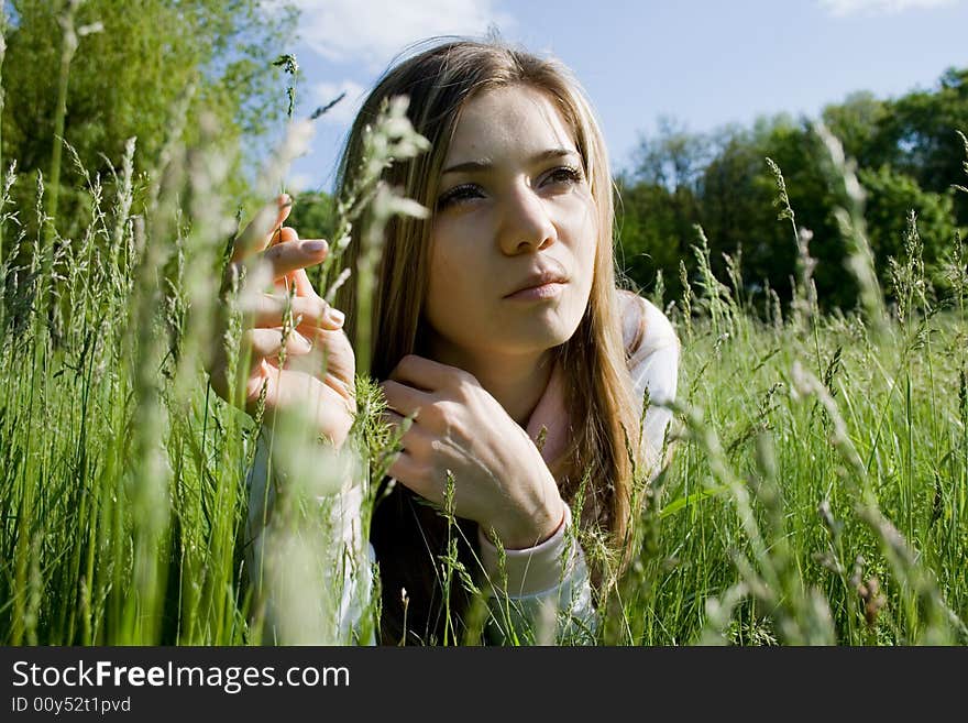 Portrait of young girl on meadow