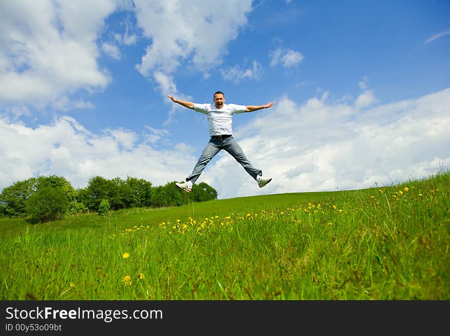 The man jumping on a lawn