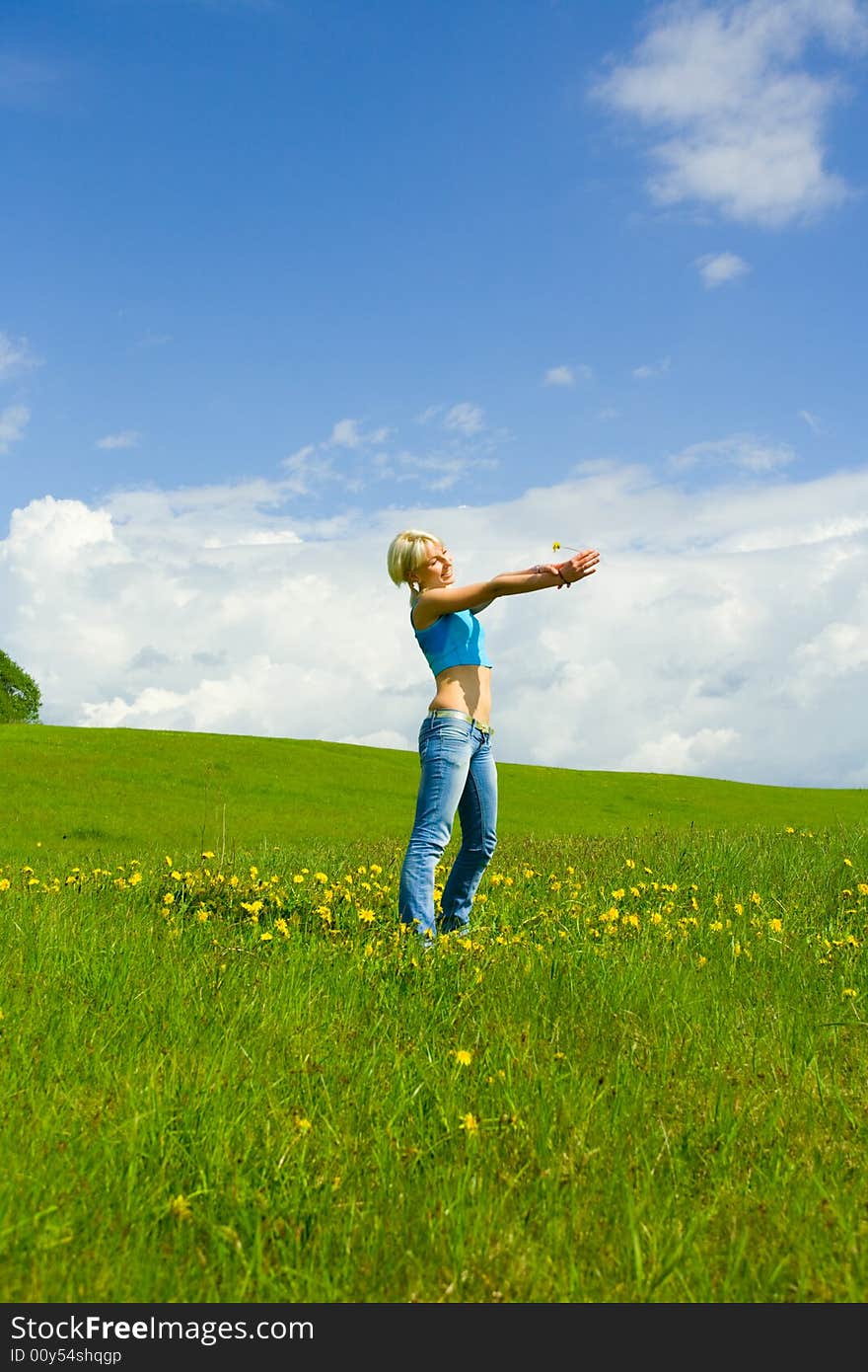 The girl jumping on a lawn