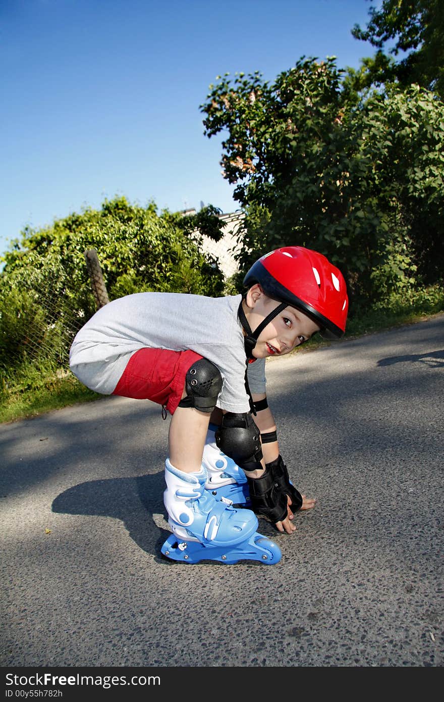 Young boy roller - blading outdoor