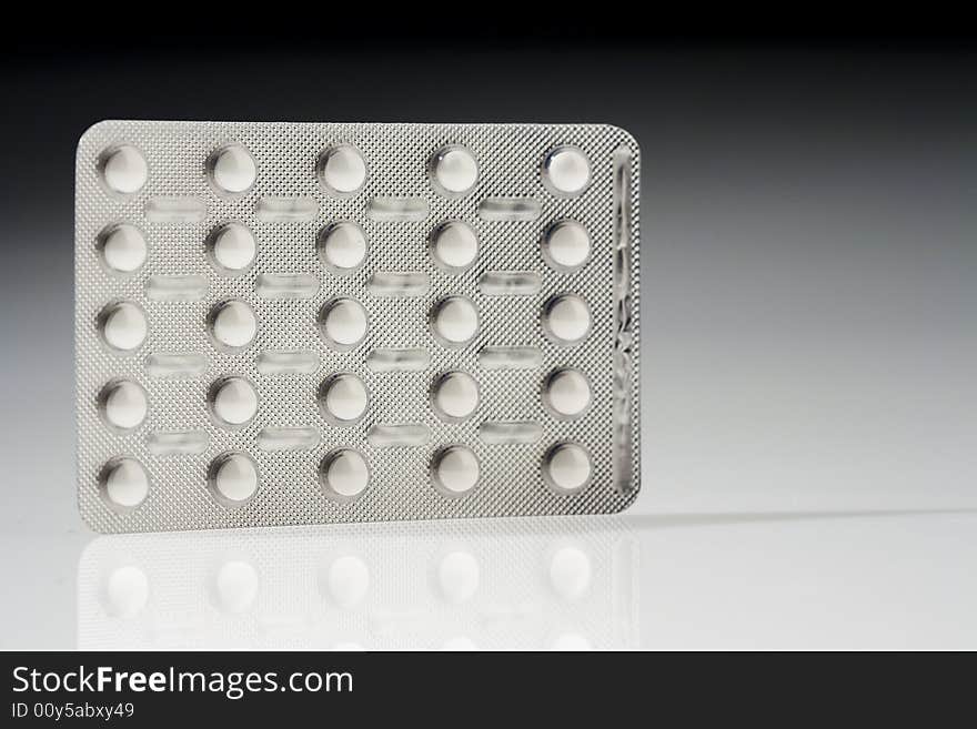 White pills pack isolated over white background