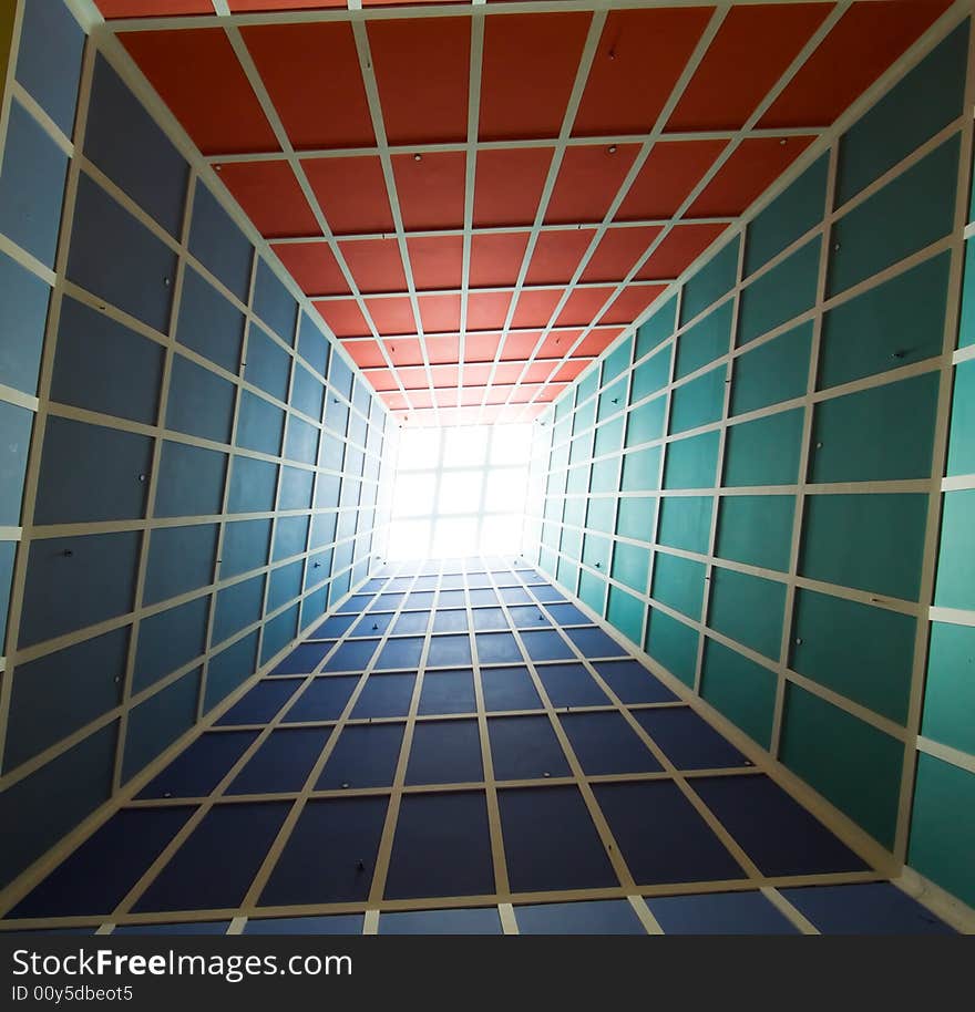 Tapering pyramid ceiling with skylight in the interior of a modern building