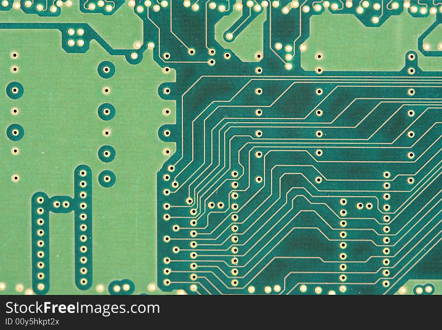 The Back of a green circuit board. The Back of a green circuit board