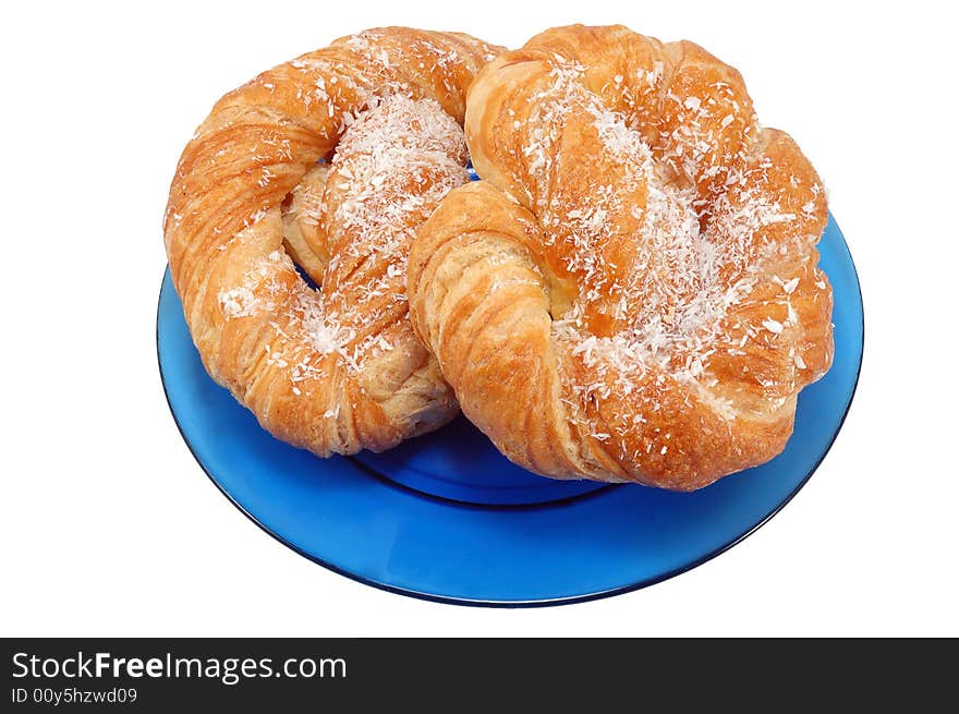 Bakery on blue plate isolated