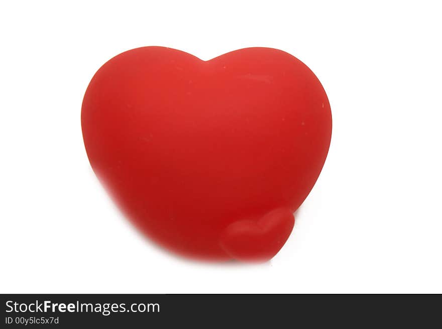 Soft red heart isolated on white