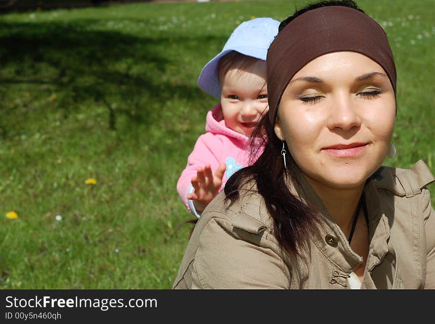 Happy mother and baby girl in park. Happy mother and baby girl in park