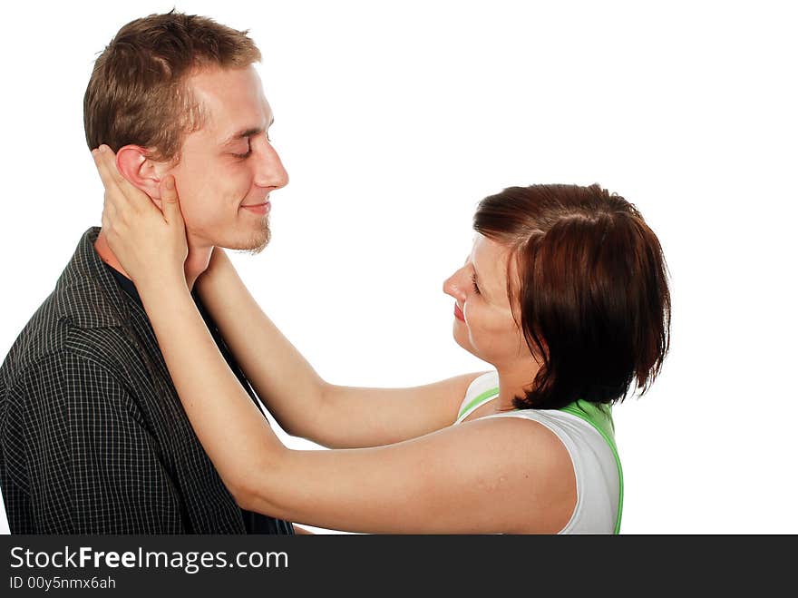 Young loving couple on white background