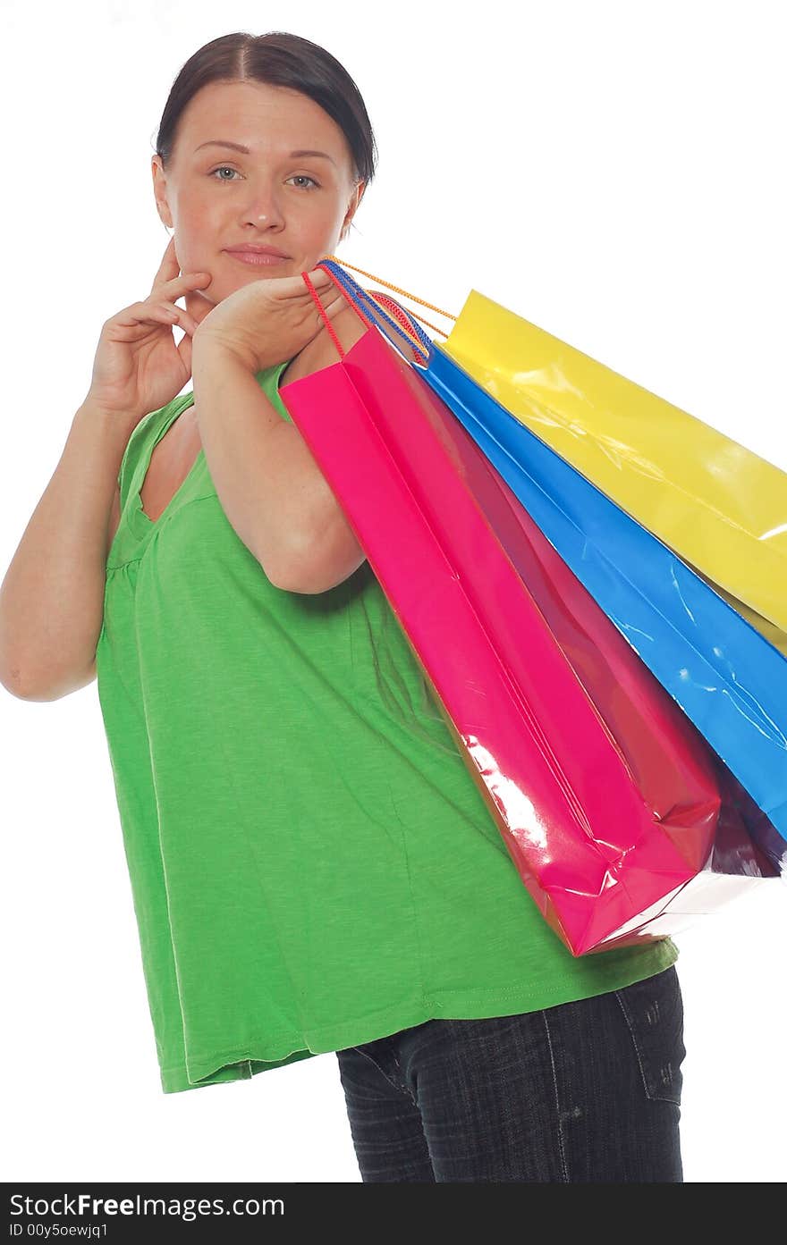 Attractive woman with shopping bags on white background