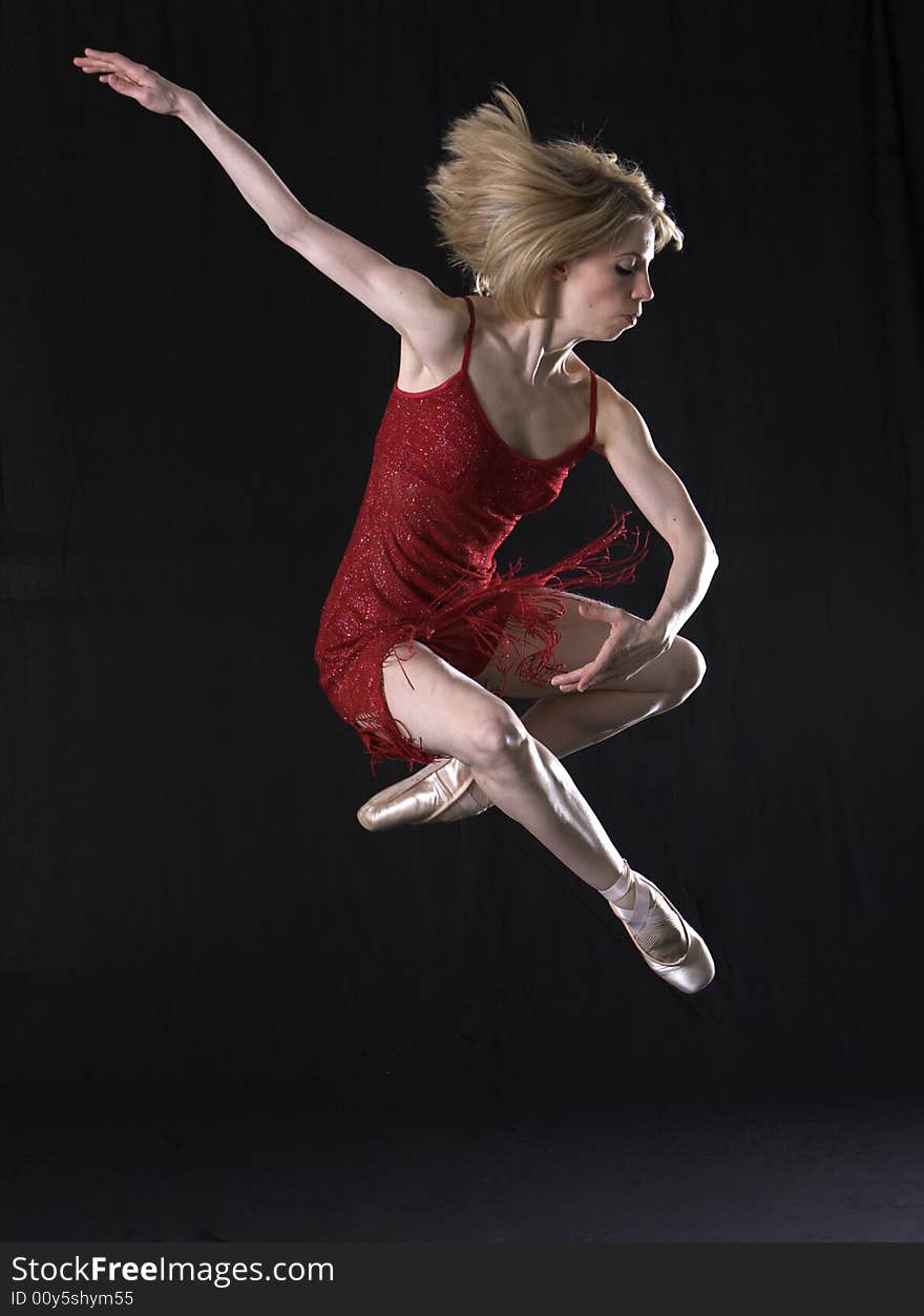 Young professional beautiful ballerina on pointe