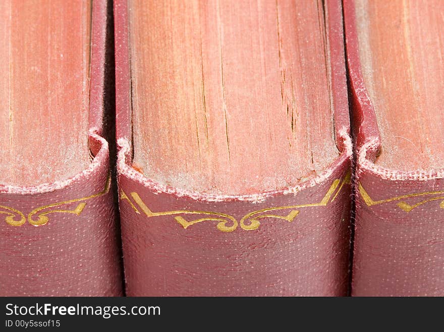 A row of very old dusty books- close up. A row of very old dusty books- close up