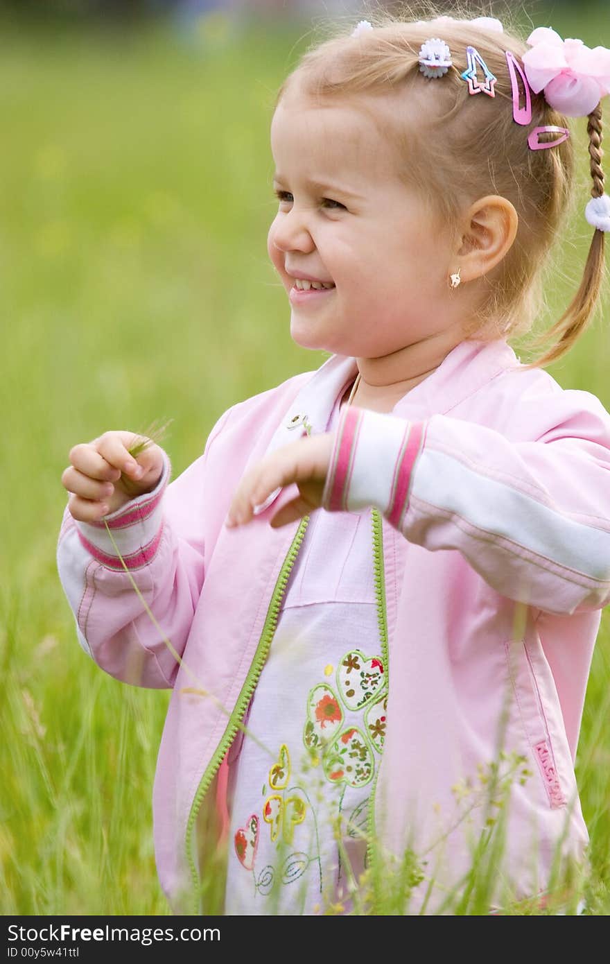 Happy little girl outdoor portrait