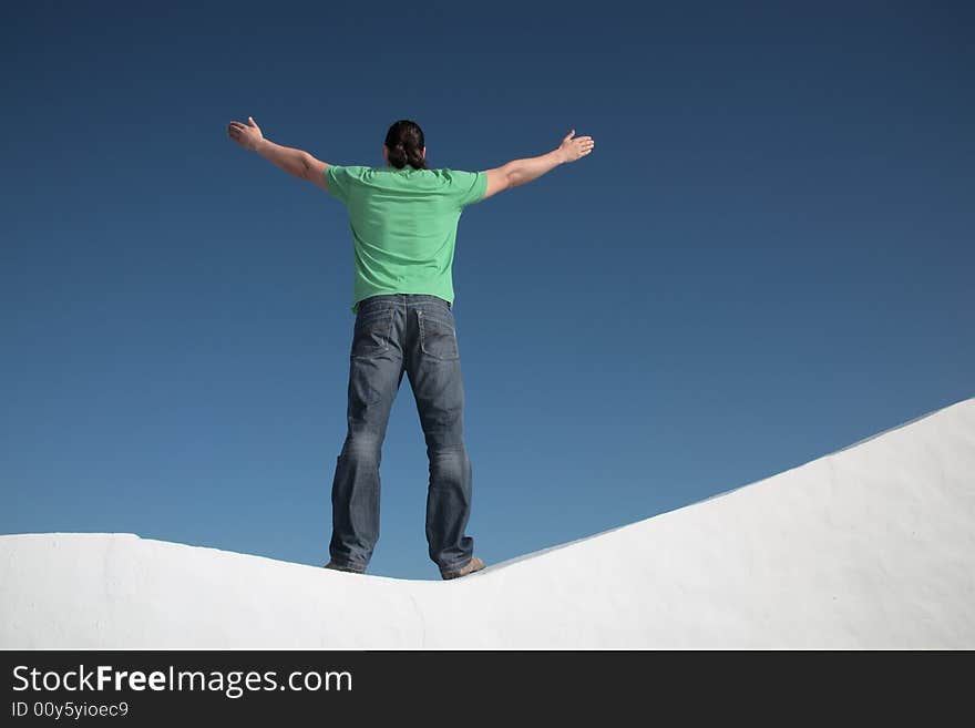 Young man with arms wide open