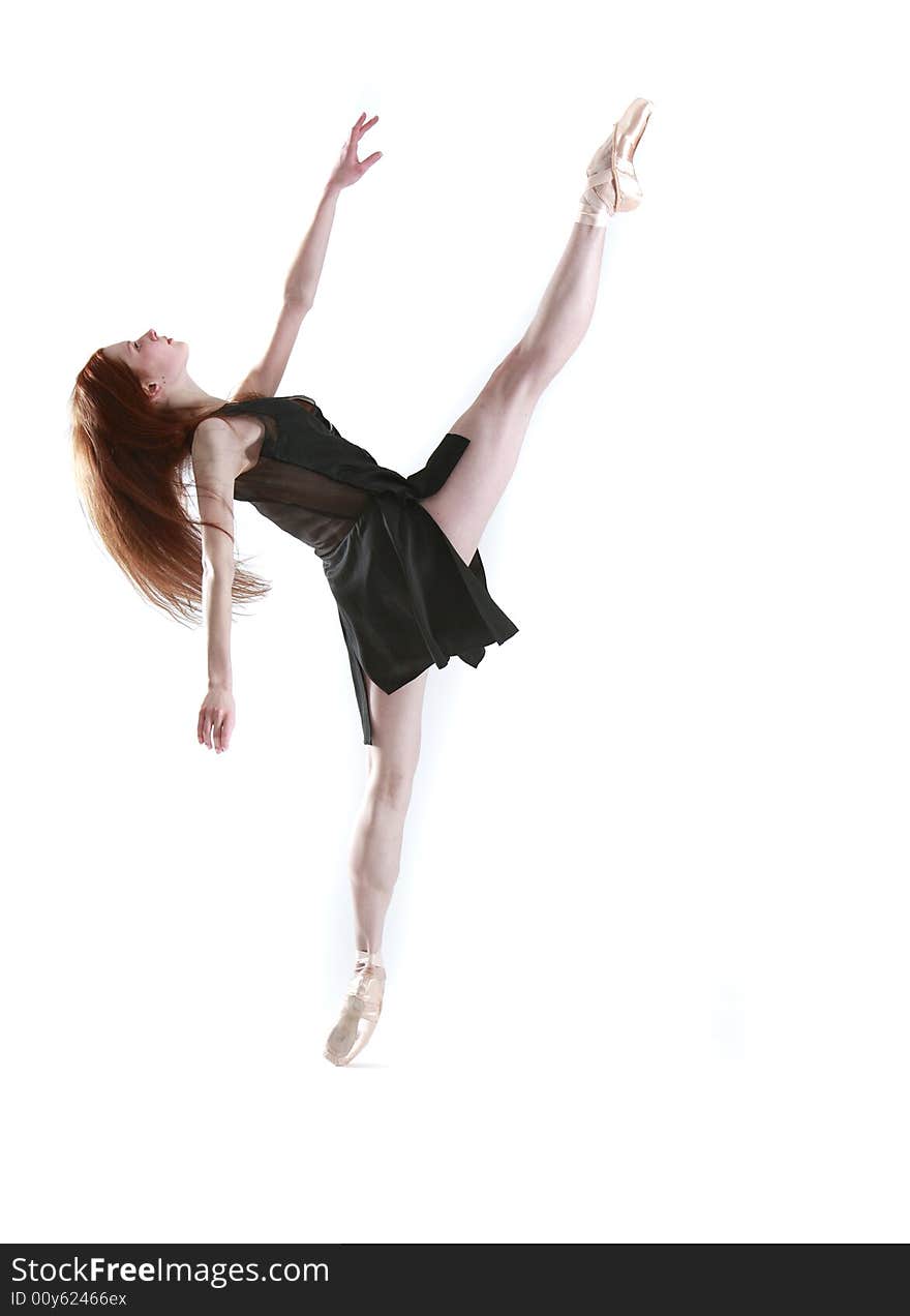 Young flexible female ballerina on pointe