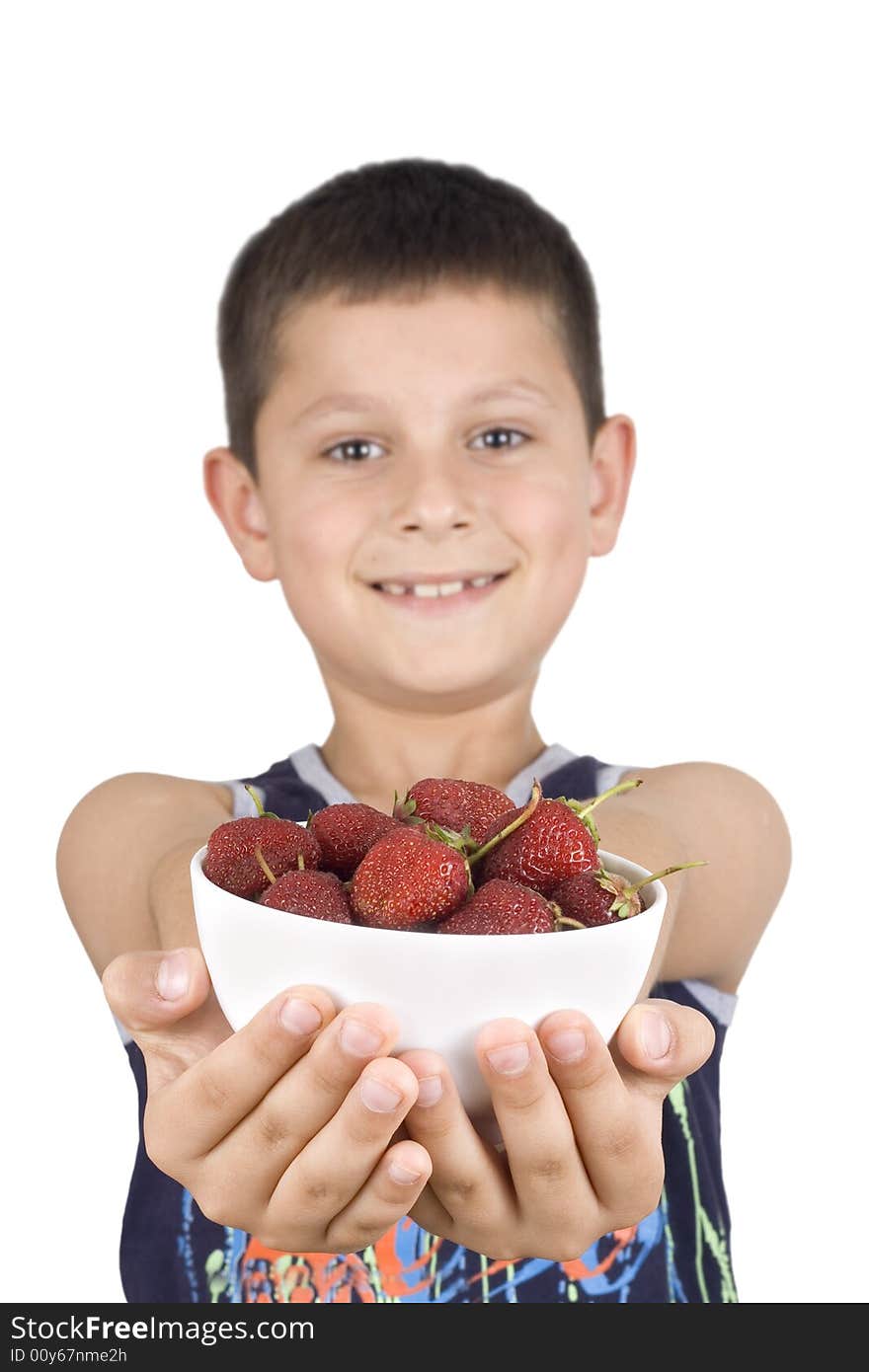 Boy holding plate with strawberry