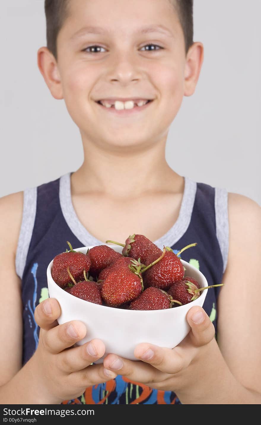 Boy And Plate With Strawberry