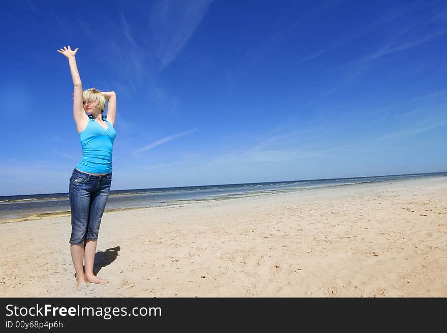 Beautiful young girl on the beach