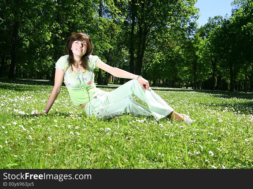 Cute happy girl relaxing outdoors. Cute happy girl relaxing outdoors