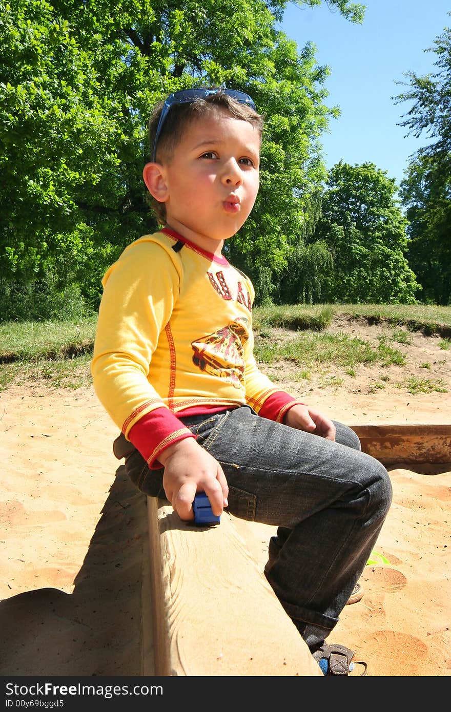 Cute little boy playing outdoors