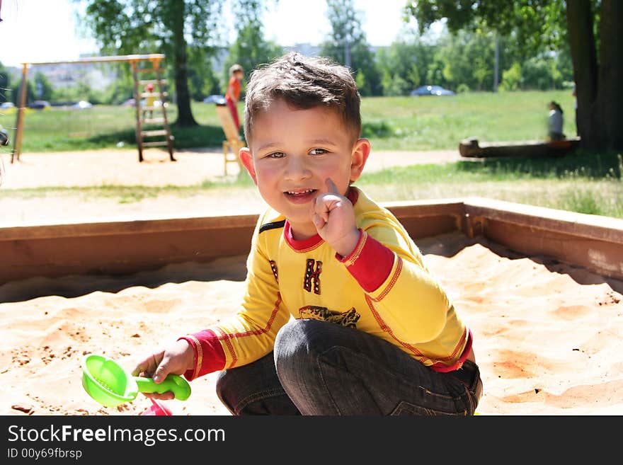 Little cute kid playing outdoors