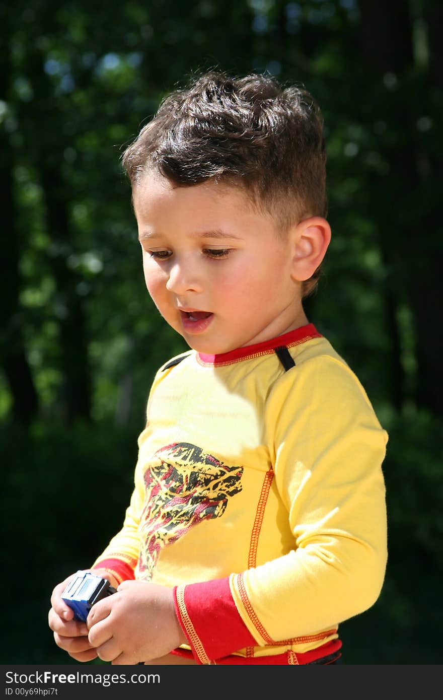 Cute little kid playing outdoors