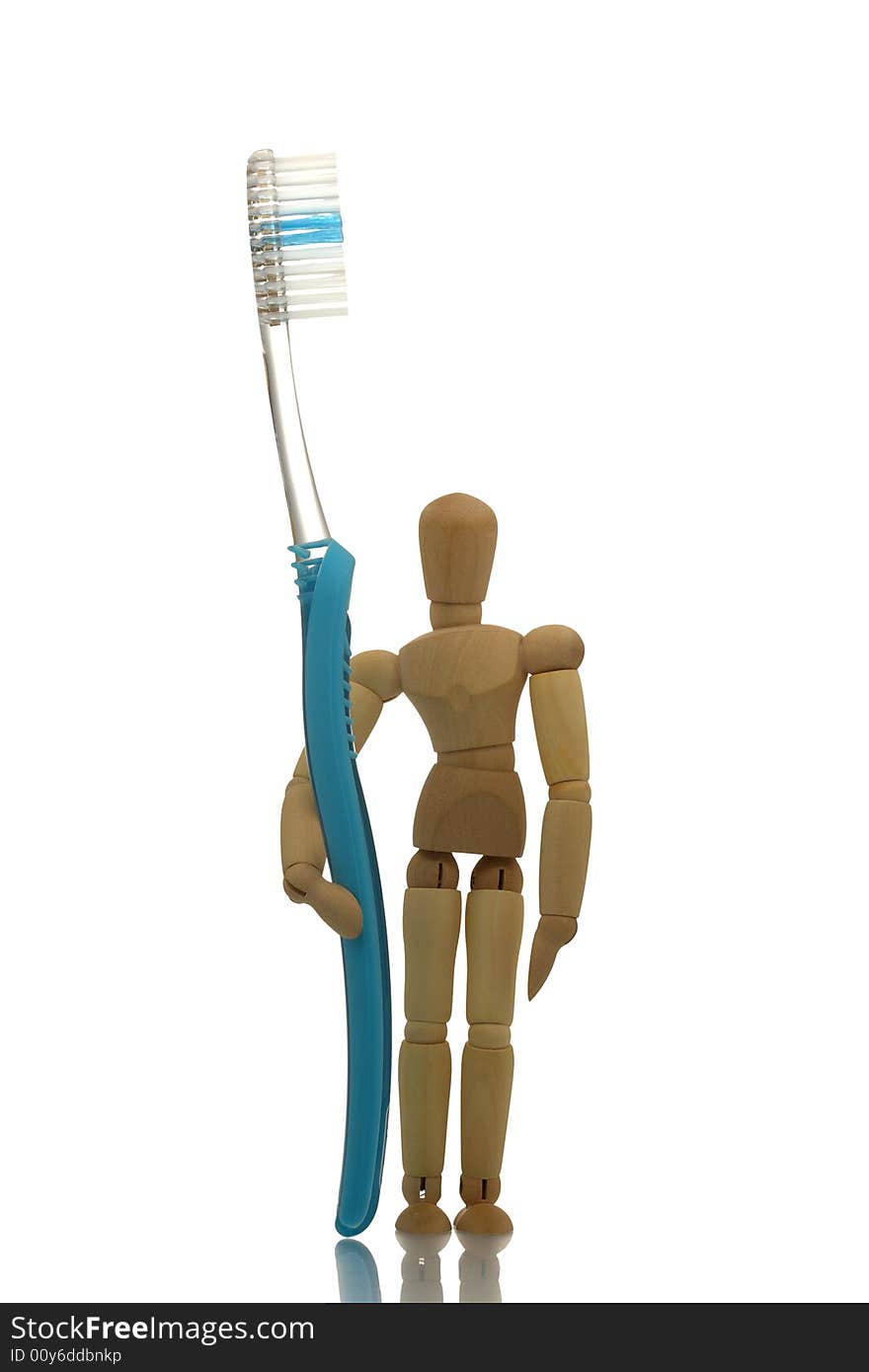 Manikin standing with blue toothbrush. Manikin standing with blue toothbrush