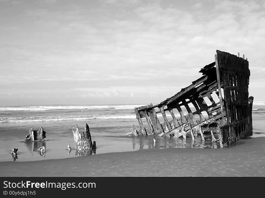 Weathered shipwreck on Oregon's north coast. Weathered shipwreck on Oregon's north coast