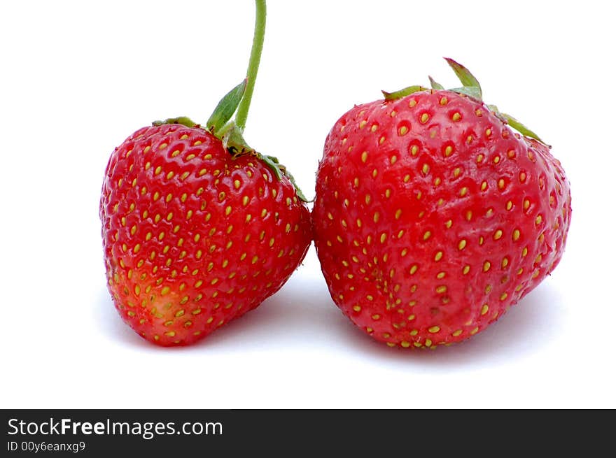 Two strawberries isolated on the white background