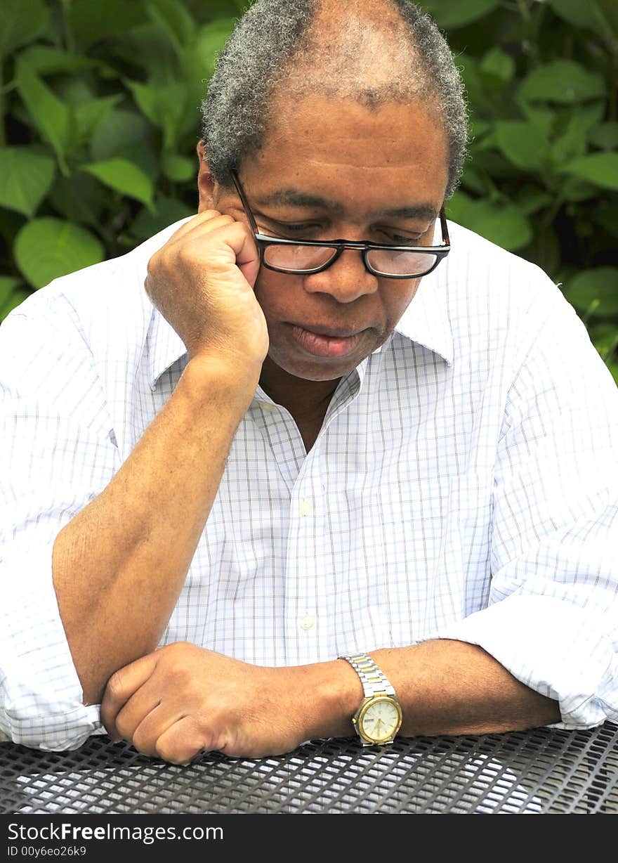 College professor relaxing on campus in between classes.