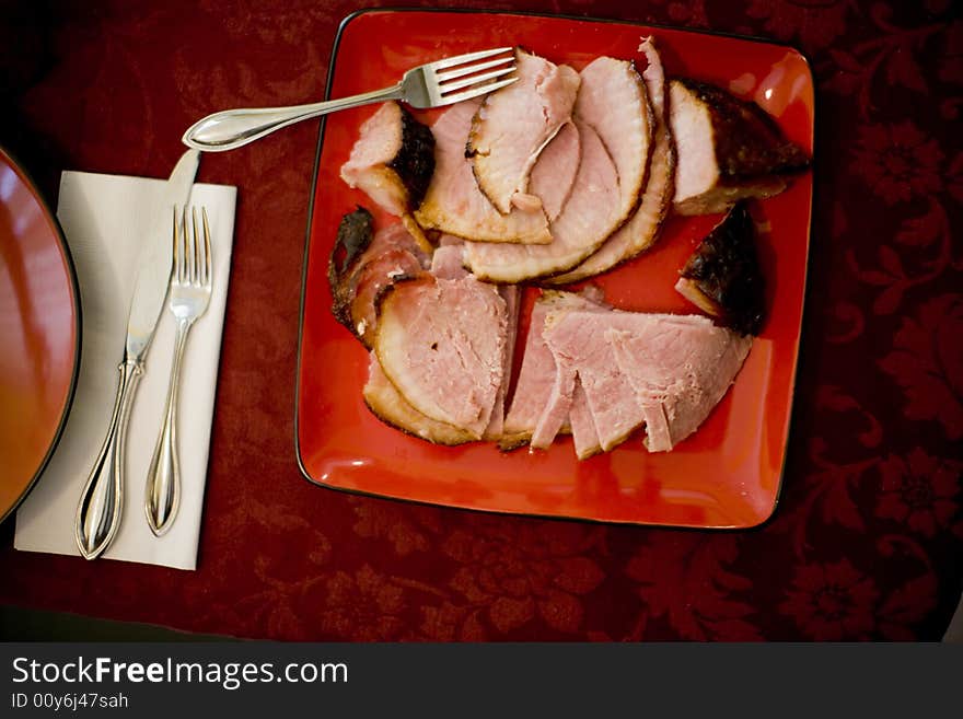 Over head view of delicious plate of ham on dinner table. Over head view of delicious plate of ham on dinner table