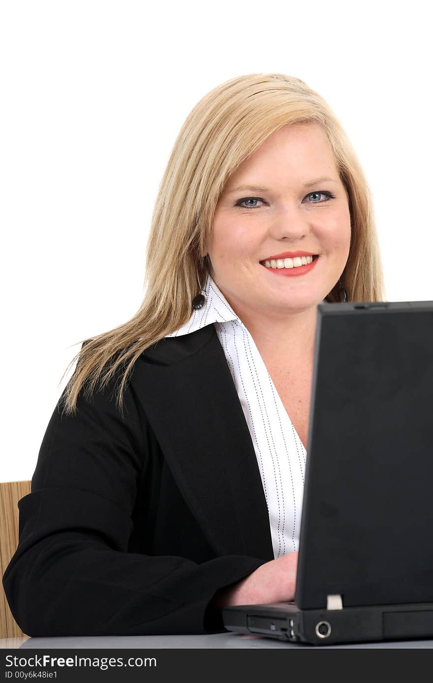 Business woman in an office environment isolated on white