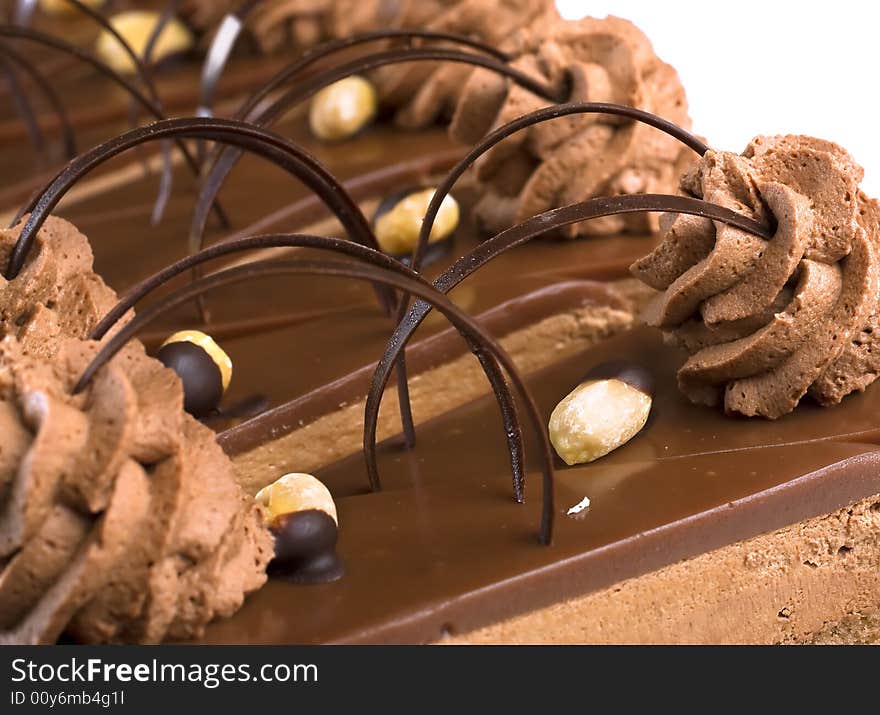 Delicious coffee and walnut sponge cakes, coated with coffee icing and sprinkled with chocolate. Delicious coffee and walnut sponge cakes, coated with coffee icing and sprinkled with chocolate.