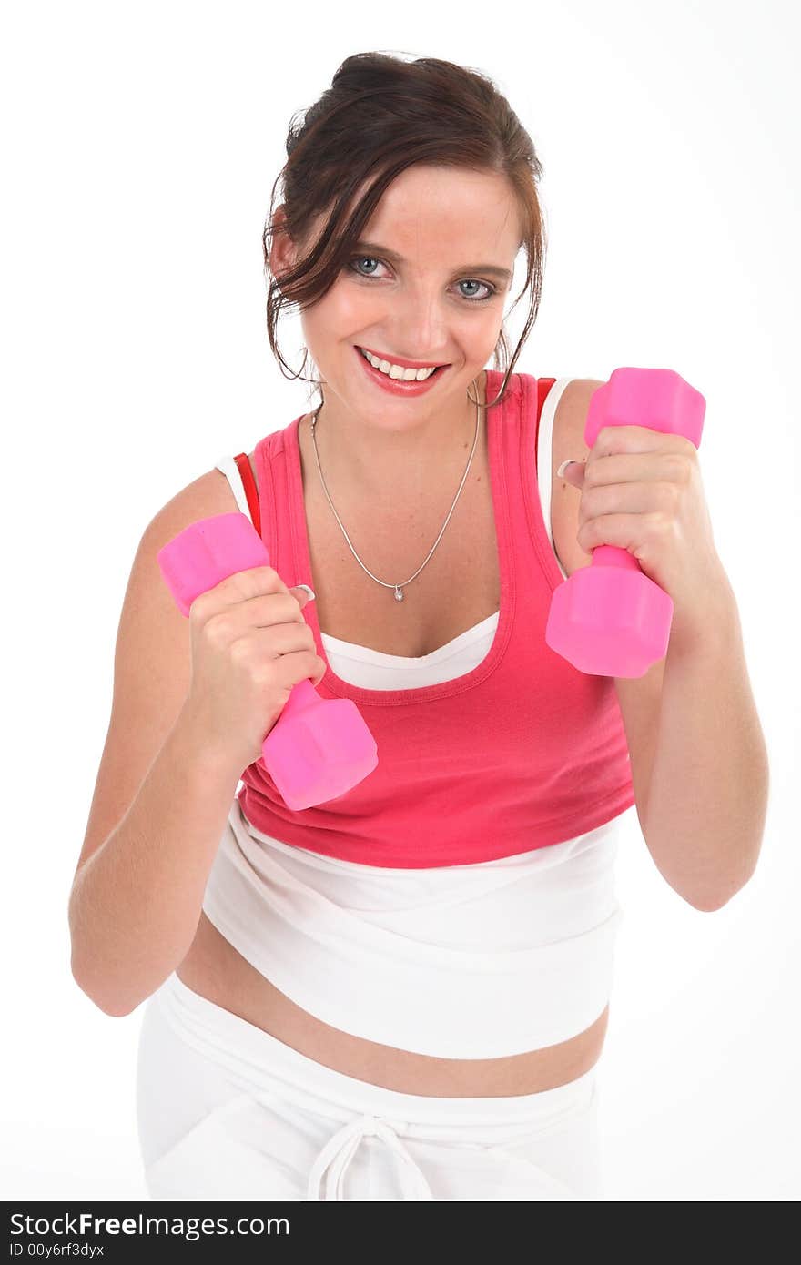 Young woman exercising with pink dumbbells isolated on white