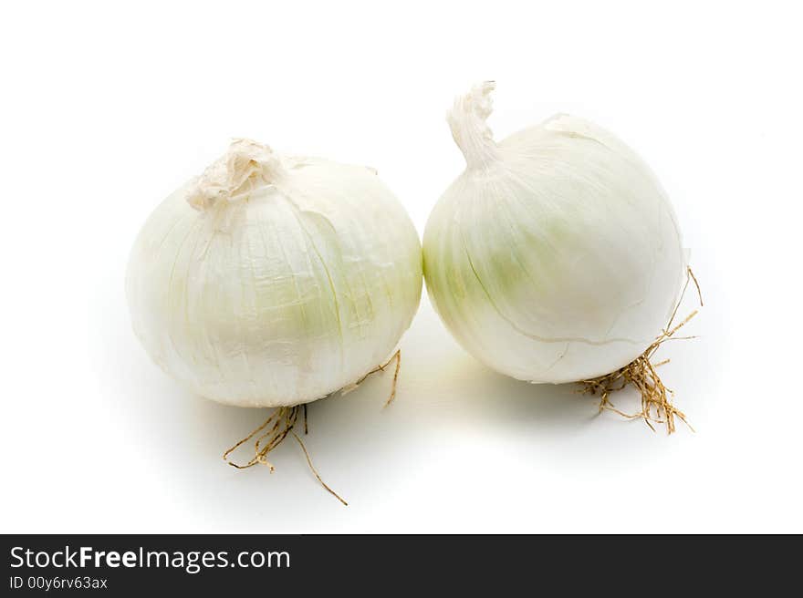 Two white onions isolated on white background