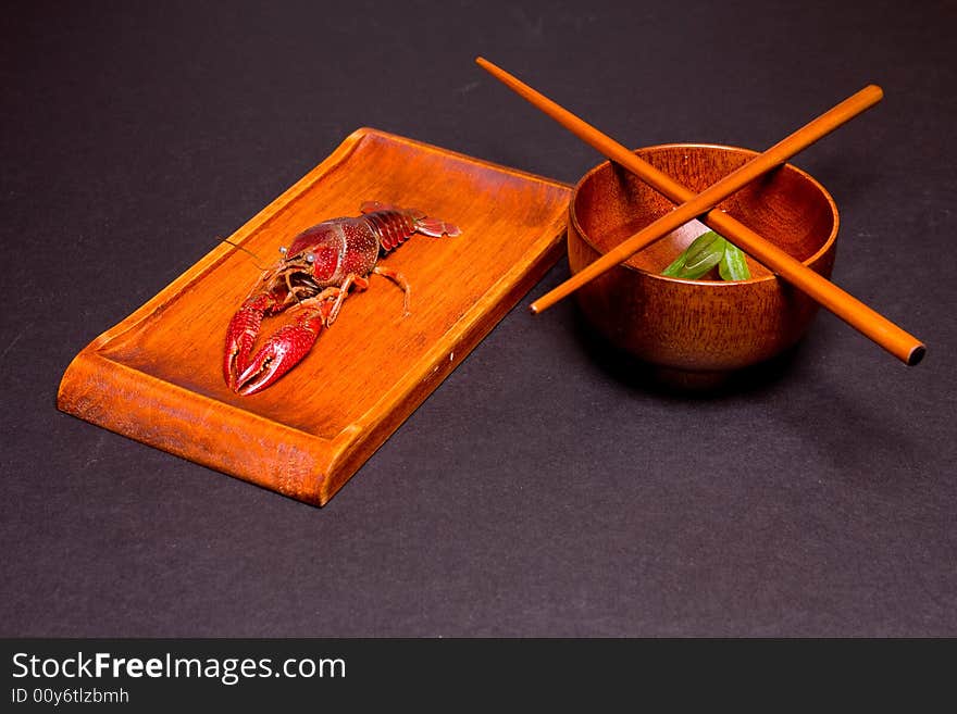 Seafood crawfish in a wooden plate. Seafood crawfish in a wooden plate.