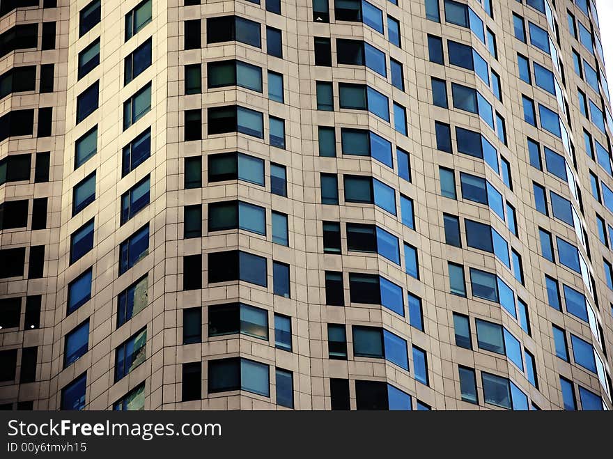 A close shot of the darkened windows of a high rise building or skyscraper in downtown Los Angeles. A close shot of the darkened windows of a high rise building or skyscraper in downtown Los Angeles