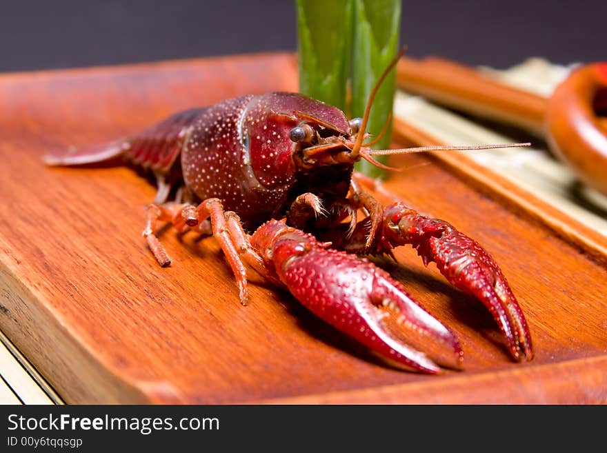 Seafood crawfish in a wooden plate. Seafood crawfish in a wooden plate.