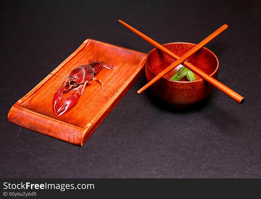 Seafood crawfish in a wooden plate. Seafood crawfish in a wooden plate.