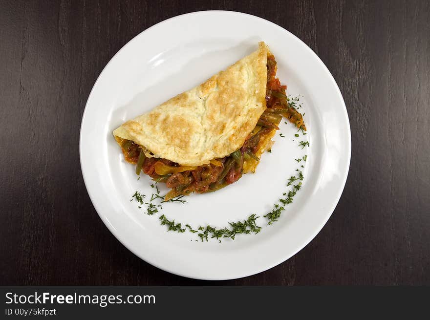 Pancakes with vegetables on a white plate. Pancakes with vegetables on a white plate.