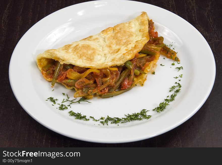 Pancakes with vegetables on a white plate. Pancakes with vegetables on a white plate.