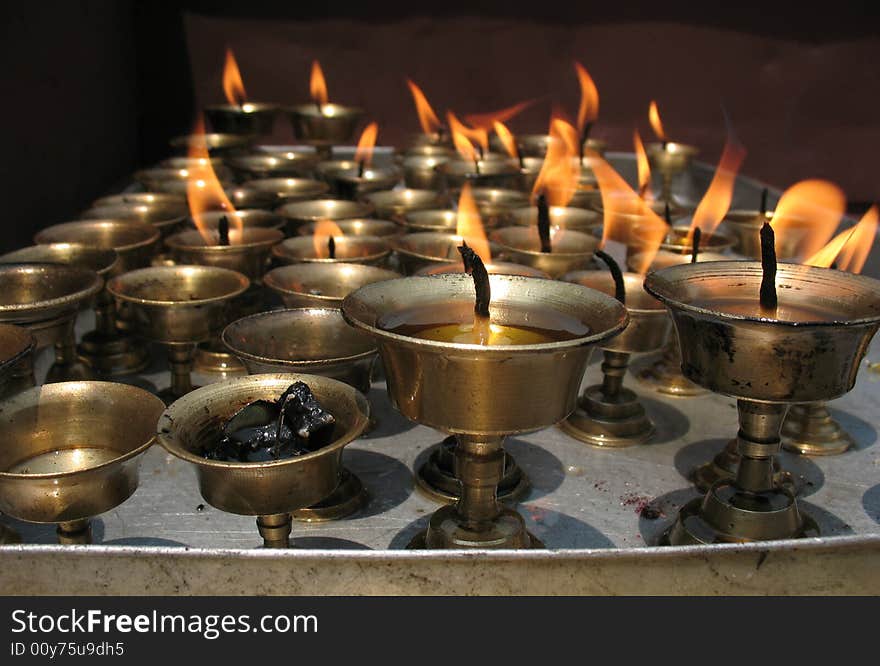 Buddhist candles burning in Kathmandu temple. Buddhist candles burning in Kathmandu temple