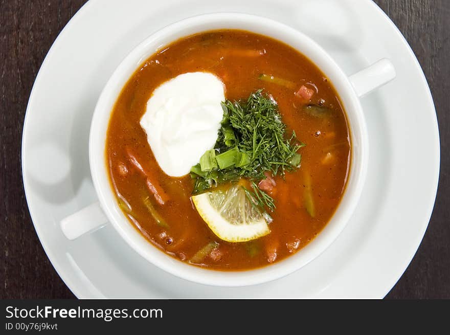 Vegetable soup on a white plate. Vegetable soup on a white plate.