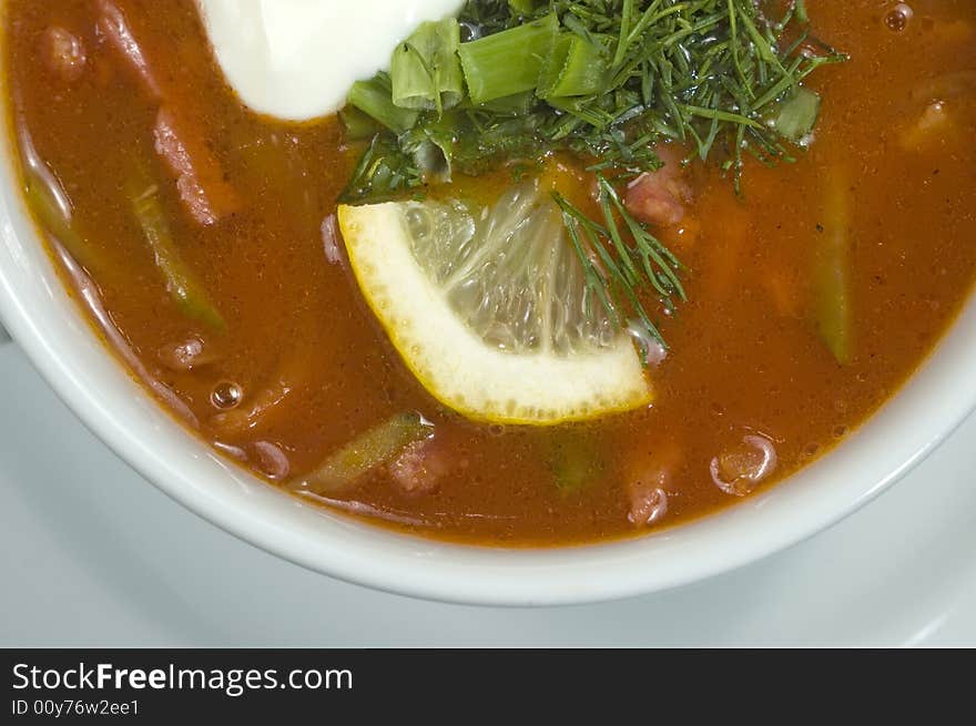 Vegetable soup on a white plate. Vegetable soup on a white plate.