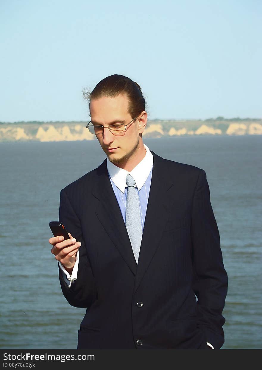 Young businessman outdoors.