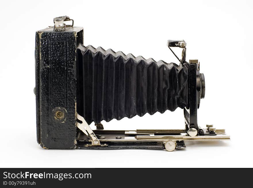 The old photographic chamber with a lens of furs on a white background. The old photographic chamber with a lens of furs on a white background.