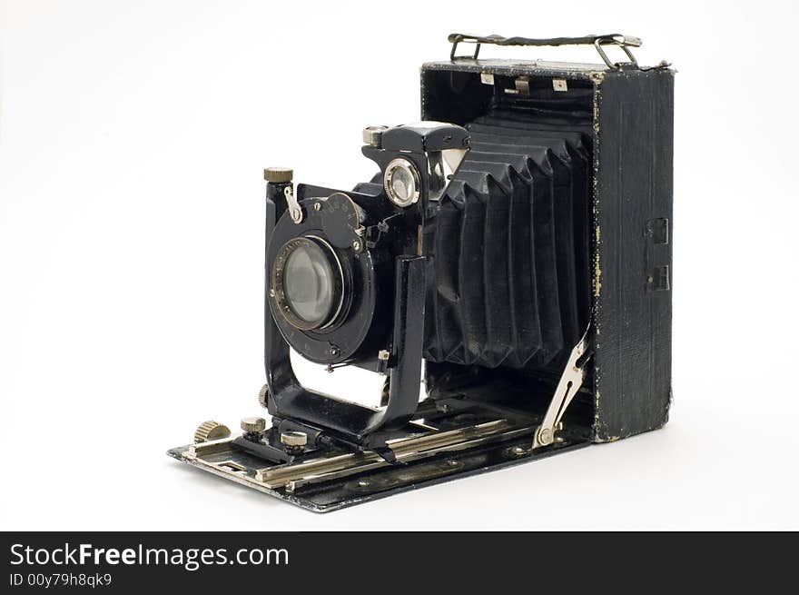 The old photographic chamber with a lens of furs on a white background. The old photographic chamber with a lens of furs on a white background.