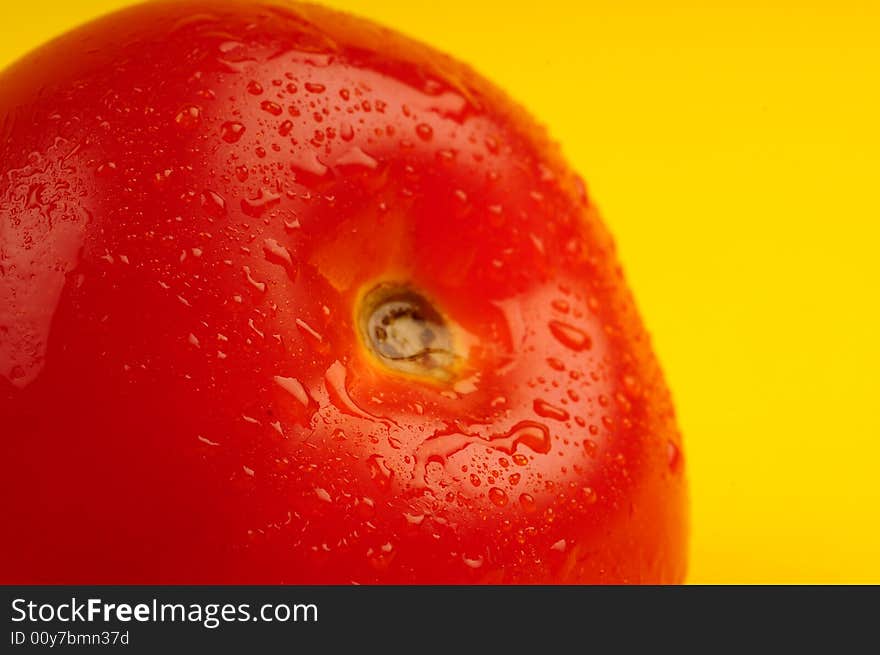 Tomato isolated on yellow background