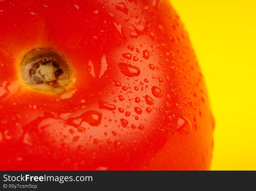 Tomato isolated on yellow background